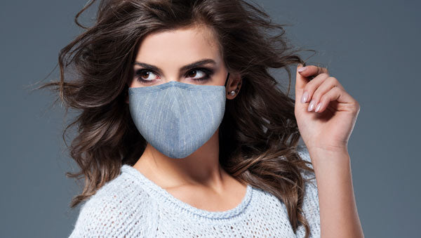 Woman wearing an OxiClear face mask